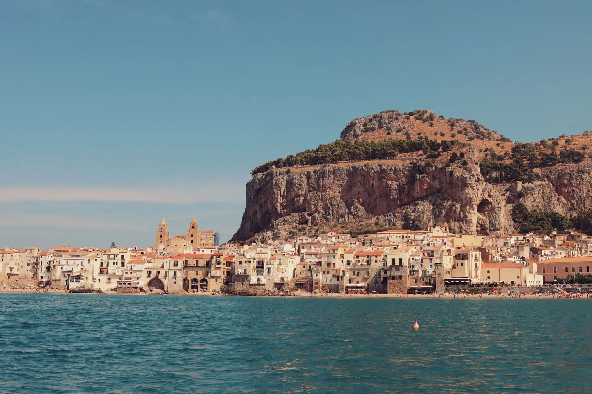 Cefalù seen from the sea with the Rocca and the Cathedral
